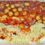 Chicken breasts in a tomato and chickpea sauce on vegetable couscous