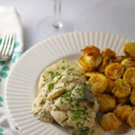 Baked fish in mustard sauce with brussels sprouts