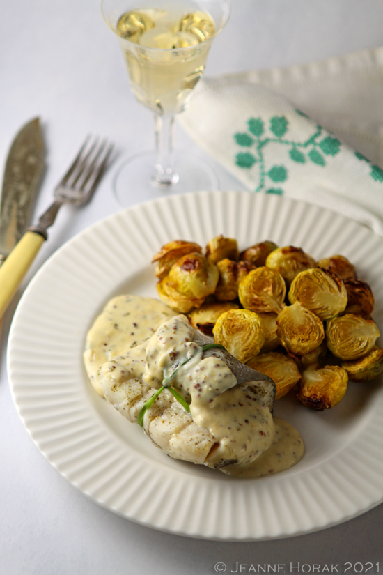 Baked dish in mustard sauce with brussels sprouts