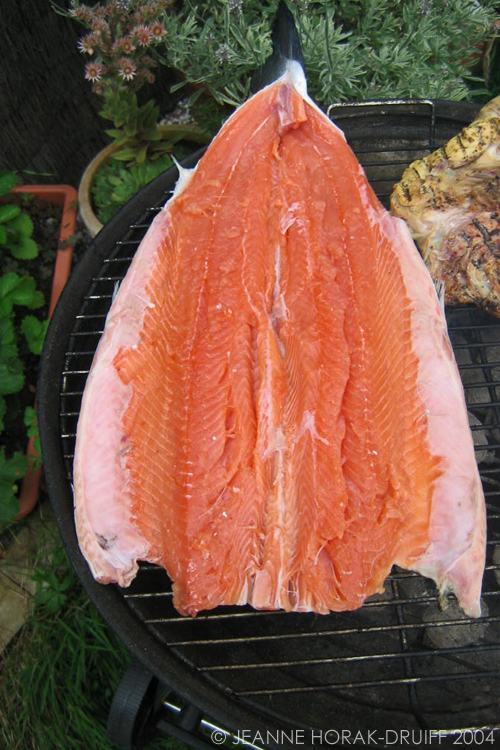 Whole butterflied salmon on the barbecue