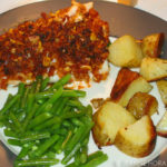 Red pesto-crusted fish with green beans and potatoes