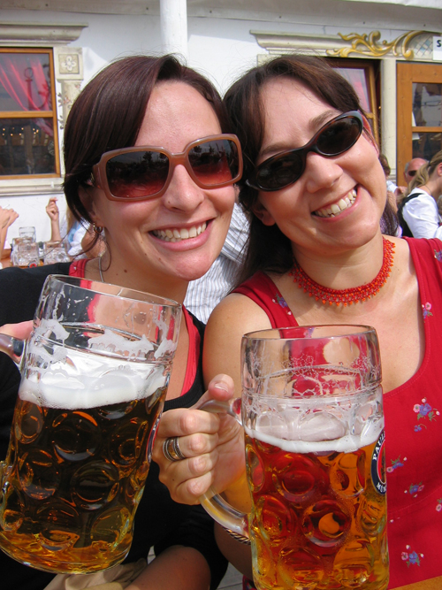 Two women drinking beer at Munich Oktoberfest