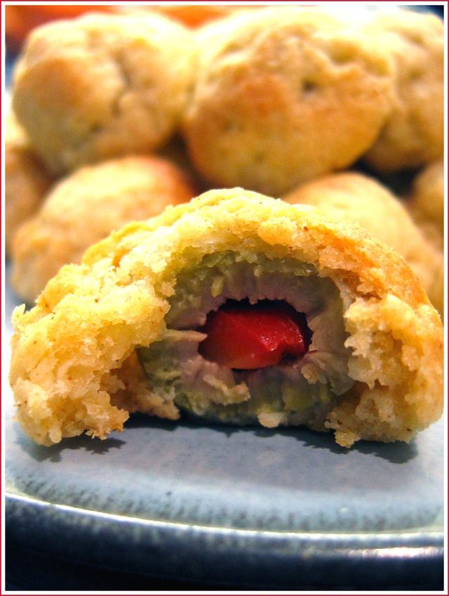 Olives wrapped in cheese pastry in a bow