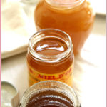 3 open jars of honey