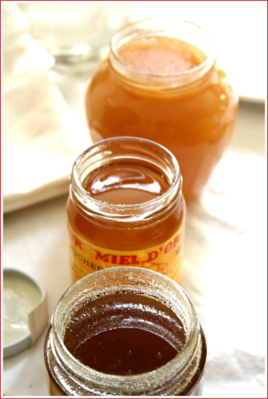 3 open jars of honey