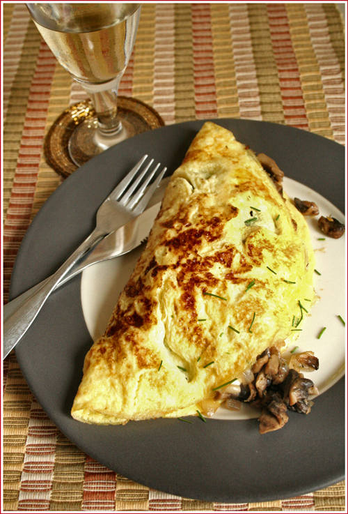 Mushroom mozzarella & chive omelette and a glass of white wine