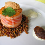 Salmon tournedos on spiced lentils