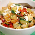Zucchini, tomato and feta cheese sauce on gluten-free pasta
