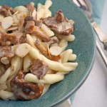 Pasta with creamy chanterelles and toasted almonds