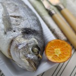 Whole baked gilt-head bream with Clemengold clementines and thyme butter