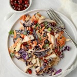 Spice up your coleslaw with the heat of harissa and the sweetness of pomegranate - a delicious twist on a classic!