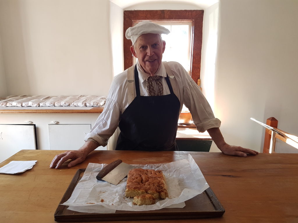 old-salem-winkler-bakery-bobby-james-with-sugar-cake