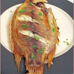 Whole baked tilapia with flat-leaf parsley and garlic