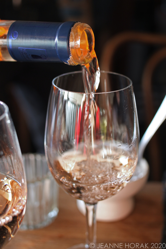 Pouring rosé wine