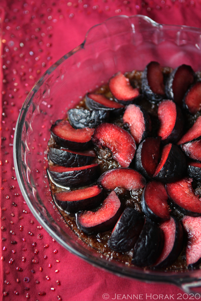 Sliced red plums