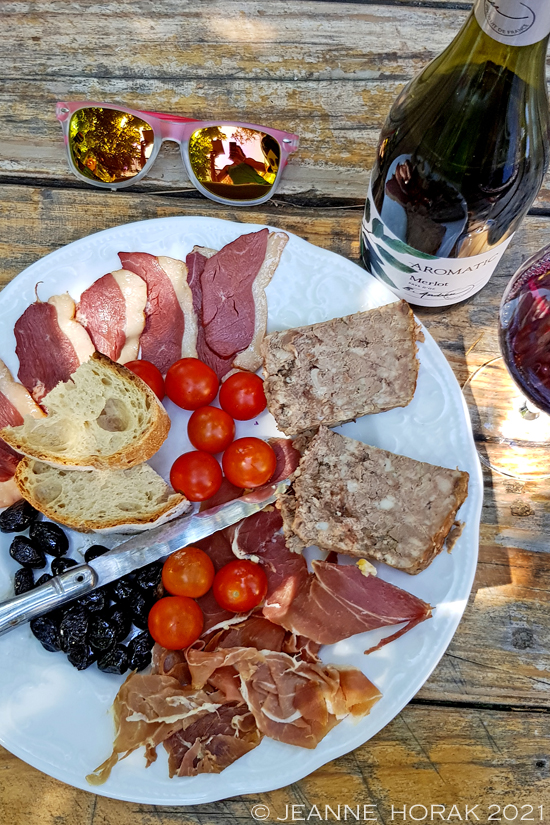 Charcuterie platter with red wine