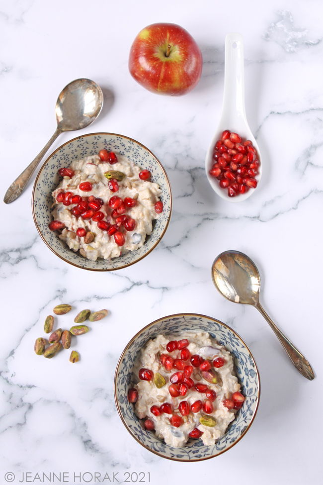 Bowls of bircher muesli with pomegranate