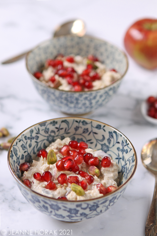 bowls of pistachio pomegranate bircher muesli