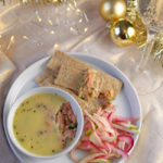 Plate of potted smoked salmon with slaw and a glass of champagne