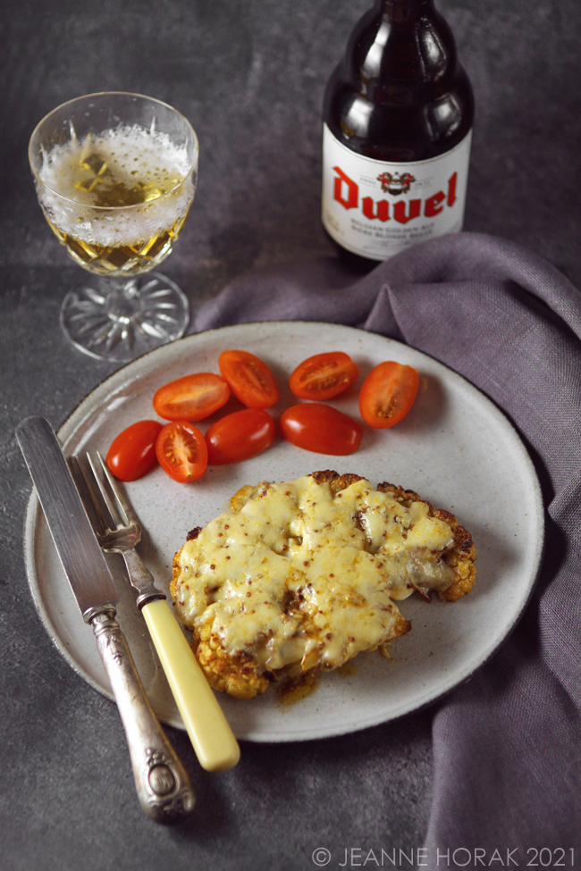 Cauliflower topped steak with melted cheese