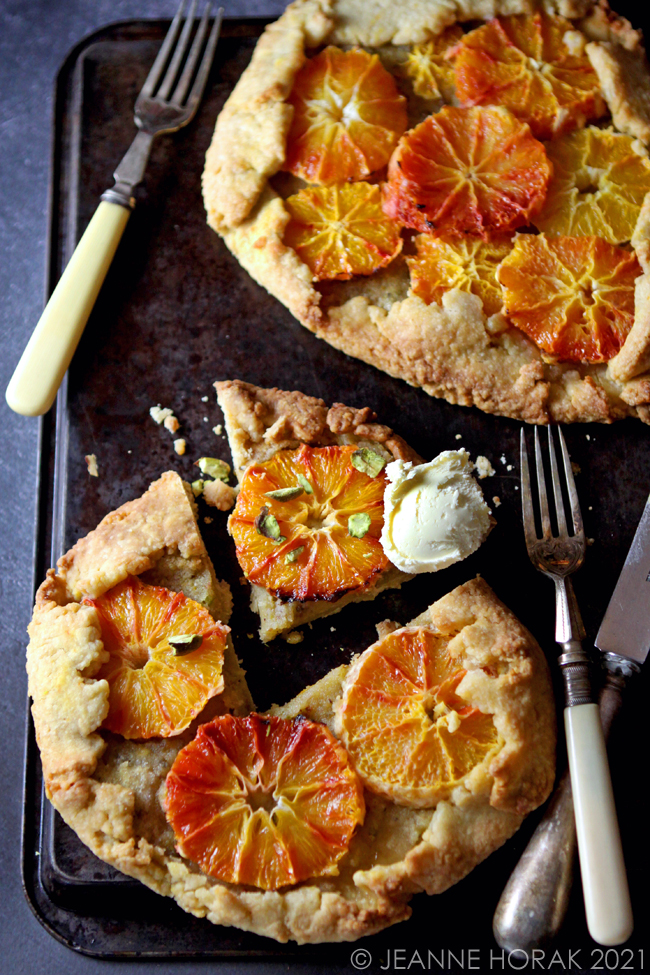 Blood orange and pistachio galettes with clotted cream